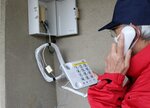 京都市内の指定避難所に配備されている特設公衆電話。発信専用で、災害時に無料で利用できる（京都市南区・元東和小）