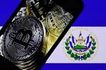 ビットコインのロゴとエルサルバドルの国旗＝９日（ゲッティ＝共同）