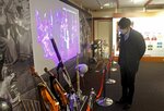 オペラで演奏されるオーケストラの楽器が並ぶ音楽塾展（京都市左京区・ロームシアター京都）